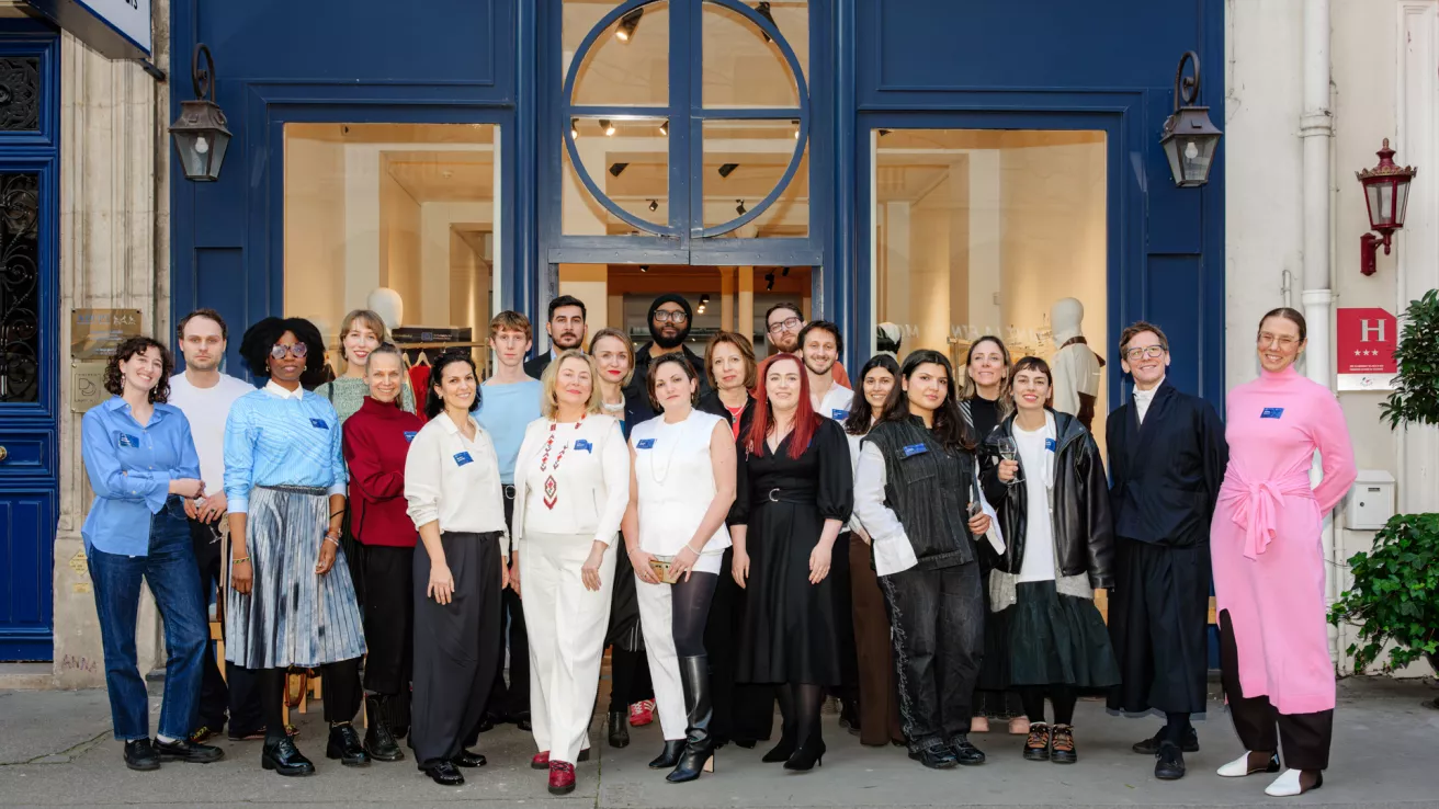 The NEB Fashion Adaptor participants pose for a photo in front of Atelier Néerlandais