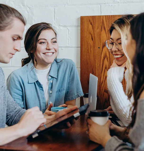 People together consulting electronic devices